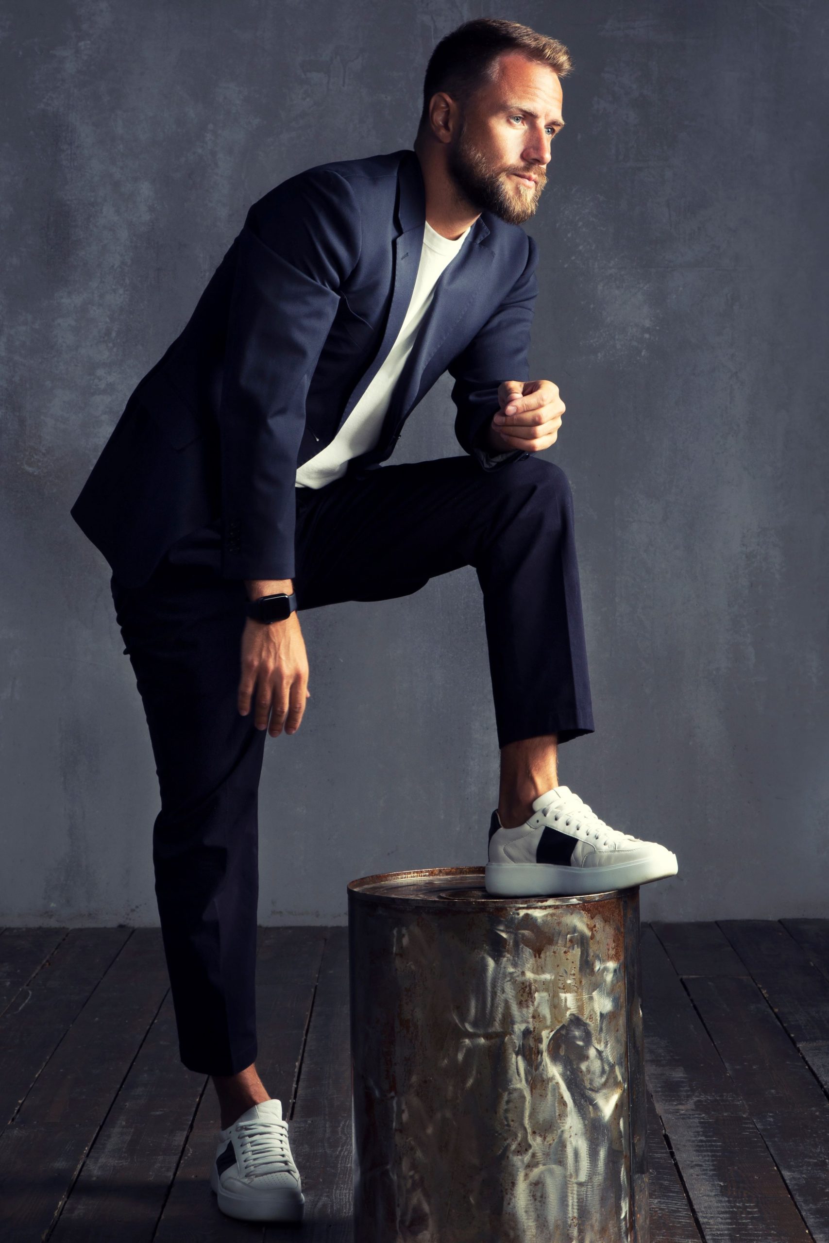 Man wearing casual suit with white sneakers